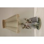 An attractive and large porcelain Lladro Table Lamp, with three figures.