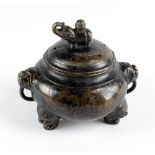 A Chinese bronze Incense Burner, with pierced cover and elephant finial,