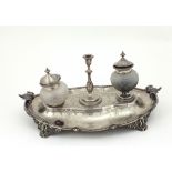 An attractive and unusual engraved silver Desk Ink Stand, with two cutglass bottles,