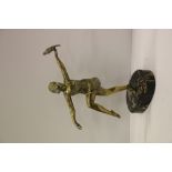 An attractive Art Deco style brass model of a Flapper type Girl,