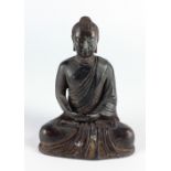 A Chinese bronzed Figure of a seated Buddha, with hands clasped and legs crossed, 9" (23cms).