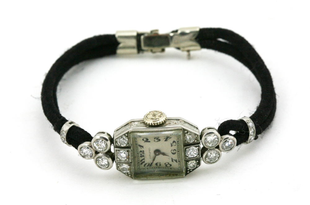 An attractive Longines Ladies Watch, 18ct white gold with diamonds, etc., hall marked eagle's head.