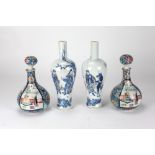 A pair of small bulbous Chinese porcelain Vases and stoppers decorated with panels of flowers and