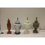 Four varied porcelain and marble Lamps, decorated in the Chinese and Classical taste, with shades.