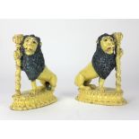 A pair of early 19th Century yellow and blue glazed Staffordshire Candlesticks,