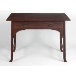 An Arts and Crafts period oak Side Table, in the manner of Voysey,