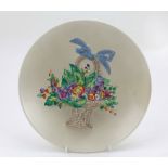 An cream ground porcelain Wall Plaque, with colourful basket of flowers by Clarence Cliff,