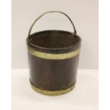 A George III mahogany brass bound Peat Bucket, 54cms (21") high.