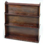 A William IV Irish double sided free standing mahogany Waterfall Bookcase, with shaped sides,