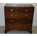 A Georgian period mahogany Chest, of two short and three long drawers with oval brass drop handles,