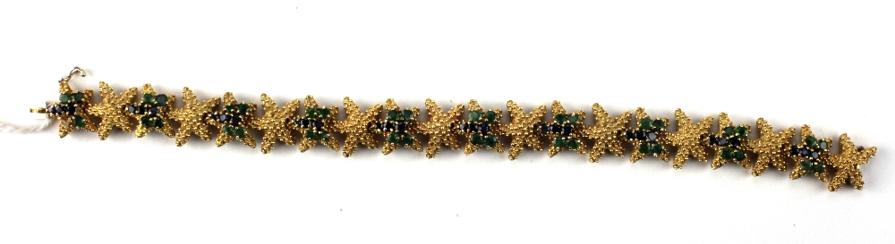 An 18ct gold Bracelet of star fish and butterfly design,