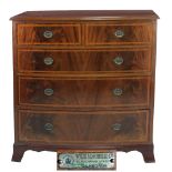 A fine Edwardian mahogany inlaid bow fronted Chest, by Wylie & Lockhead, Glasgow,