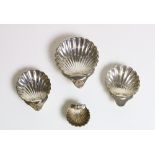A set of 4 silver graduating shell design Dishes, approx. 7 ozs.