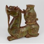 A 19th Century carved spinach jade 'Archaic', of dragon with carved design, approx.