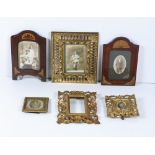 A collection of various Picture Frames, including three carved and pierced giltwood frames,