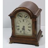 An attractive dome shaped oak framed Bracket Clock,