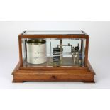 An Edwardian oak cased Barograph, with five bevelled glass panels, and base drawer.