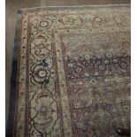 A large blue ground and floral decorated Middle Eastern style silk Carpet, approx.