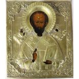 A 19th Century Russian Icon, Saint Nicholas, with embossed brass oklad, 30cms h x 26cms (12" x 10").
