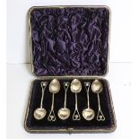 A set of 6 cased Art Deco silver Teaspoons, hall marked c. 1894, in leather case.