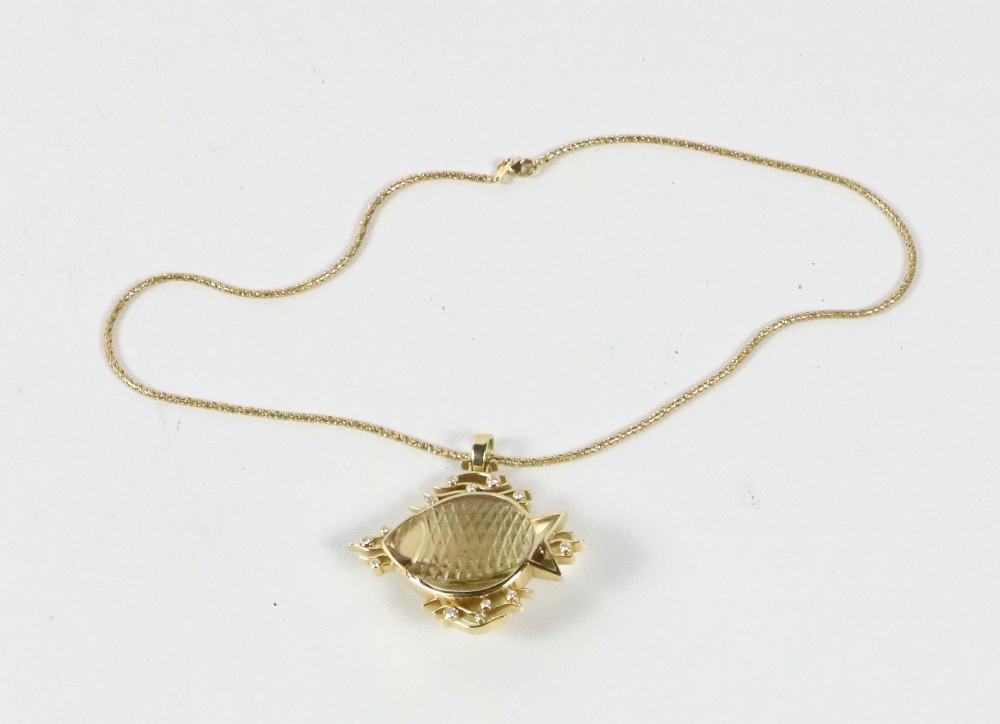 An 18ct yellow gold Pendant, set with 'fish' shape citrine (cut by Hobein) inset with 0.