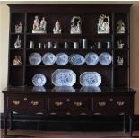 A good 18th Century oak Dresser Base, the three frieze drawers with brass drop handles,