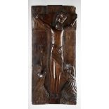 An 18th Century carved walnut Panel, Greek or Russian depicting the crucifixion of Christ,
