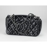 A Chanel black quilted patent lather single flap Handbag,