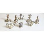 Silverware: A collection of varied Condiments, including mustard ports, salts and peppers,