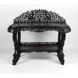 An impressive and unusual Oriental hardwood Side Table, with carved and pierced back, top,