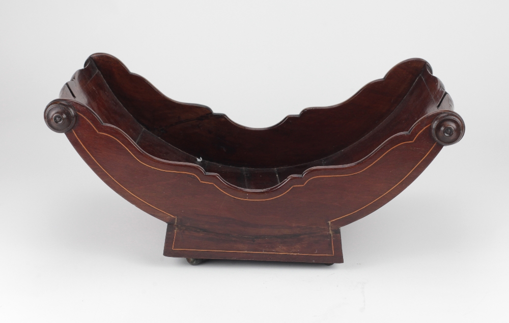 A Georgian inlaid mahogany Cheese Coaster, with turned handles on wooden castors.