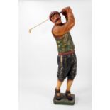 A tall caricature model of a Golfer, wearing typical attire.