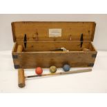 An oak cased Croquet Set, with mallet, balls etc.
