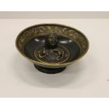 A 19th Century heavy bronze and gilt highlighted Bowl,