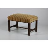An attractive wooden framed upholstered Window Stool, covered in cream ground fabric.