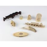 A collection of various carved ivory Trinkets,