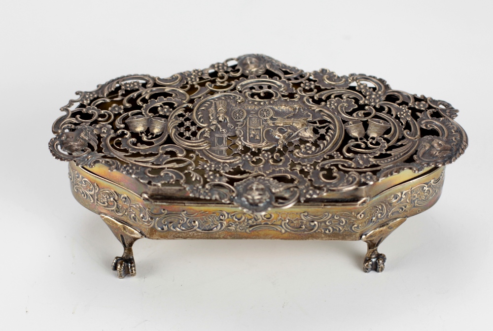 An attractive pierced decorated silver shaped Box, designed with horse drawn carriage, bells,