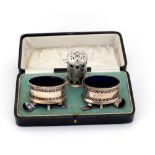 A cased pair of silver Mustard Pots, and spoons,