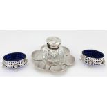 An attractive pair of Sterling silver oval Salt Pots, with pierced decoration in the Adams style,