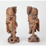 A pair of 19th Century carved hardwood Chinese Candle or Incense Holders, modelled as Sages,