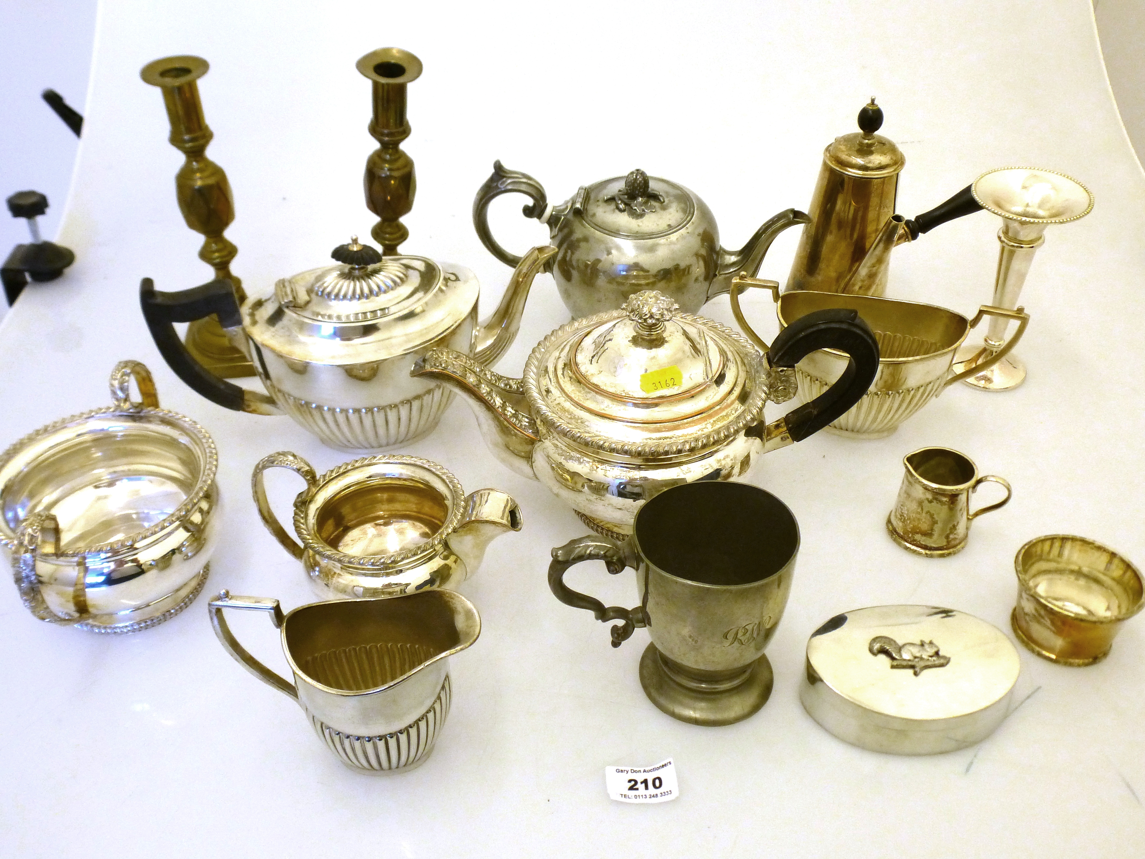 QUANTITY OF ASSORTED PLATED WARE AND BRASS CANDLESTICKS