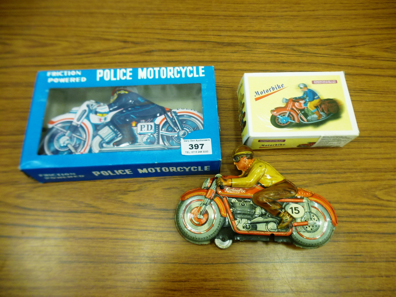 3 TIN MOTORCYCLES (2 BOXED)