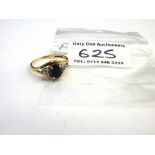 9K GOLD RING WITH BLACK AND WHITE STONES W: 2.2G