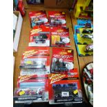 8 BOXED JOHNNY LIGHTNING VEHICLES INCLUDING JAMES BOND, THE MONKEES AND STARSKY AND HUTCH