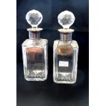 PAIR OF SILVER RIMMED DECANTERS H: 10.75"