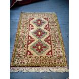 BEIGE AND RED PATTERNED TURKISH RUG 81" X 53.5"