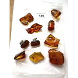 BAG OF ASSORTED AMBER PIECES INCLUDING CUFFLINKS AND BROOCH