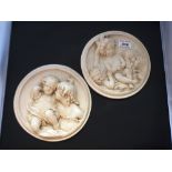 PAIR OF CHERUB POTTERY PLAQUES D: 7"