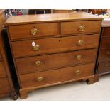 19th century light oak chest of two short over three long graduated drawers raised on bracket