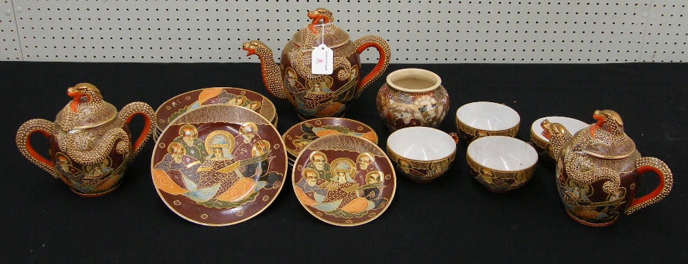 Japanese Satsuma earthenware part tea service decorated with figures and gilt highlights